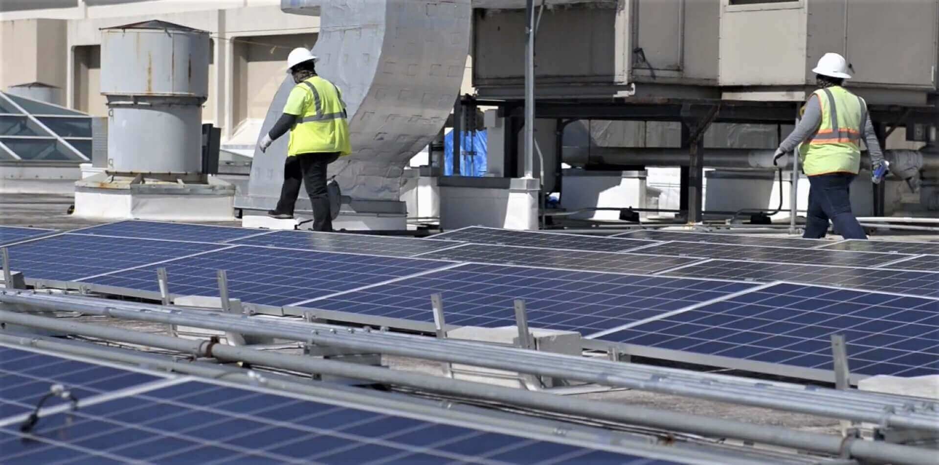 experts checking commercial solar - Solar Alternatives