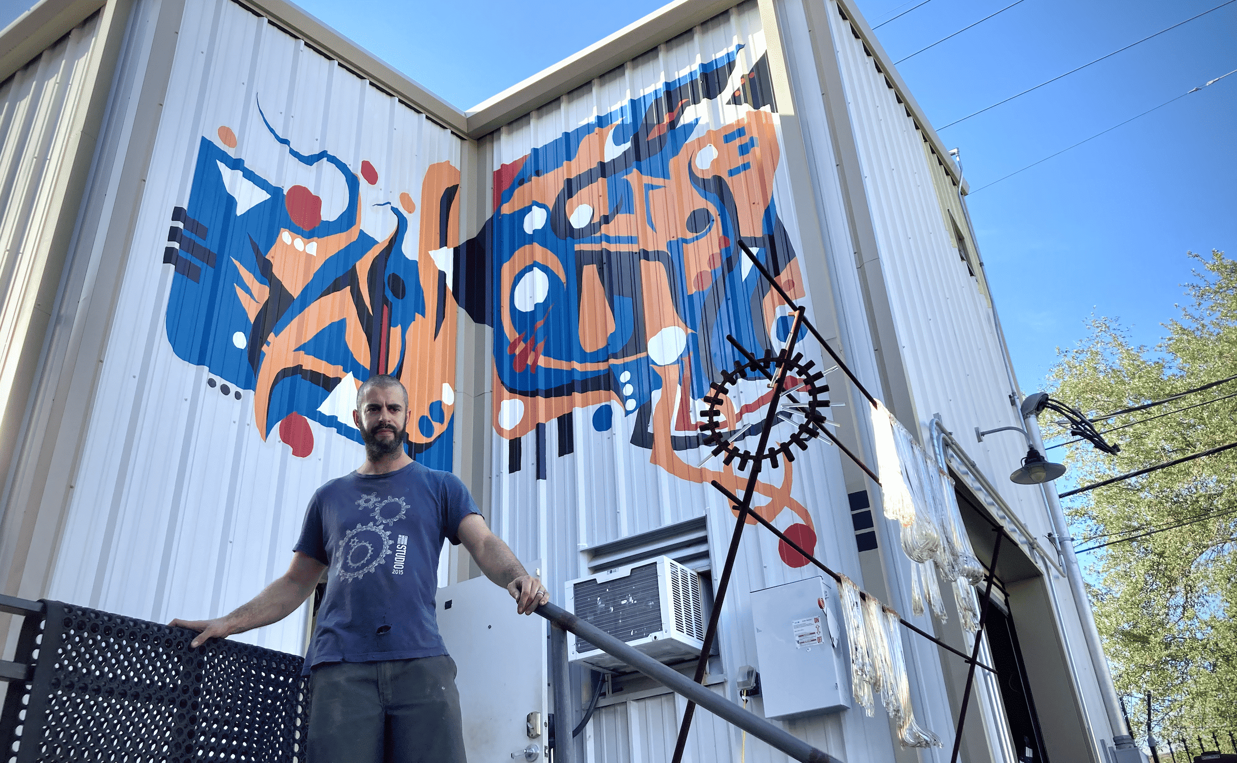 Ben Dombey in front of his solar powered Shop - Solar Alternatives